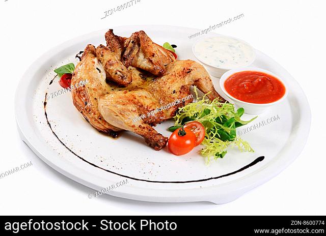 The baked hen with salad close up