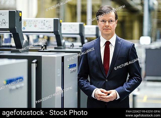 27 April 2022, Baden-Wuerttemberg, Wiesloch: Ludwin Monz, CEO of Heidelberger Druckmaschinen AG, stands at a printing unit in a factory hall at the company's...