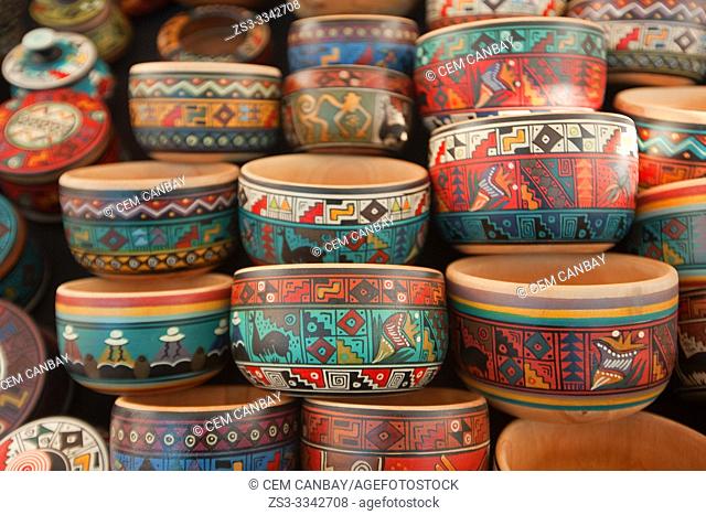 Close-up shot of wooden bowls at the open-air market in Pisac, Sacred Valley, Cusco Region, Peru, South America