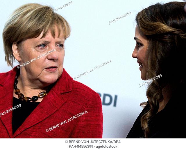 German Chancellor Angela Merkel (l, CDU) and Queen Rania of Jordan pose for photographs at the BDI's Day of German Industry 2016 in Berlin, Germany