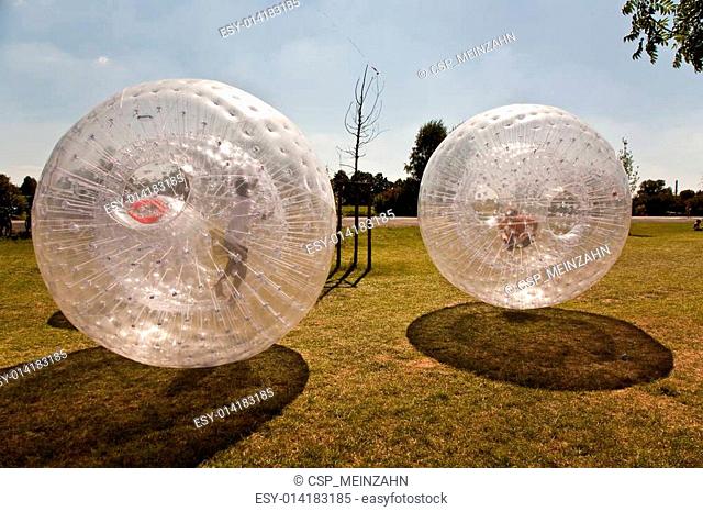 cute child has a lot of fun in the Zorbing Ball
