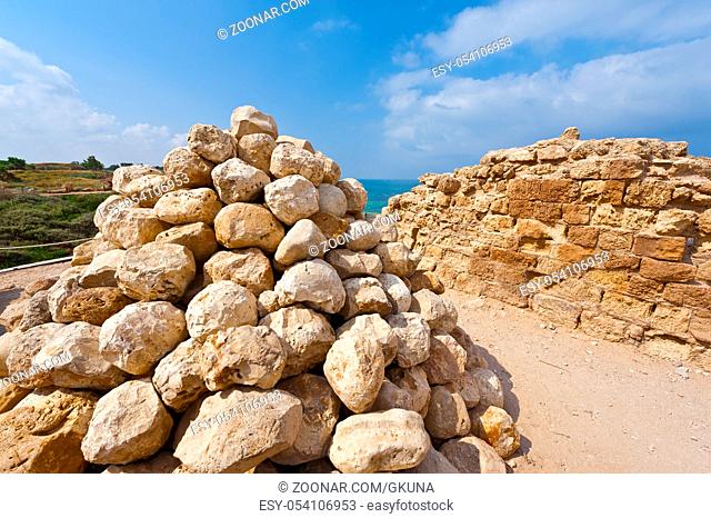 Ruins of the crusader fortress of the city Arsour in Israel. Ballista stones near the inner gate of fortification in the Israeli Apollonia national park