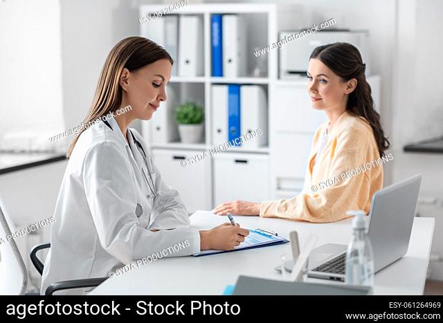 female doctor and woman patient meeting at clinic