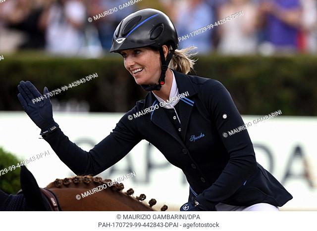 German show jumper Simone Blum celebrates finishing in second place after riding DSP Alice during the Grand Prix of Berlin 1