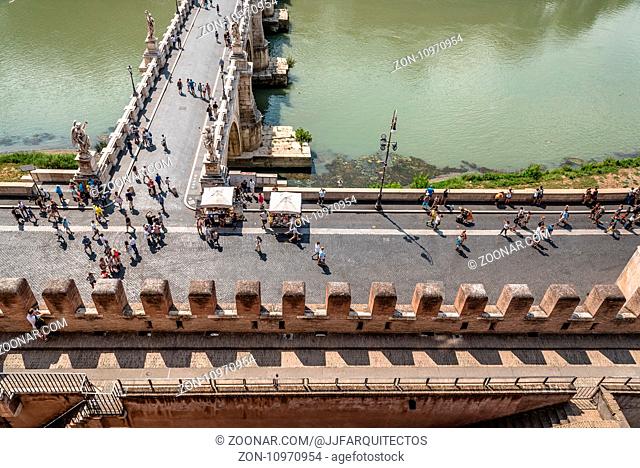 Rome, Italy - August 19, 2016: Crowd of tourists in bridge of Castel Sant Angelo. High angle view. The Mausoleum of Hadrian