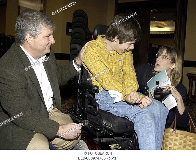 Young man with significant disabilities spending time with family and friends