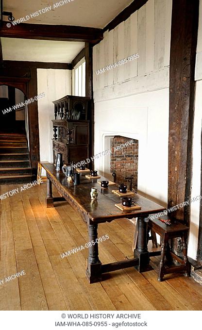 Timber framed reception hall with table at Blakesley Hall, a Tudor residence, on Blakesley Road, Yardley, Birmingham, England. It dates to 1590