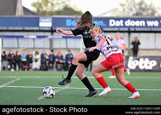 Lies Bongaerts (21) of Woluwe pictured fighting for the ball with Imani Prez (11) of Zulte-Waregem during a female soccer game between SV Zulte - Waregem and WS...