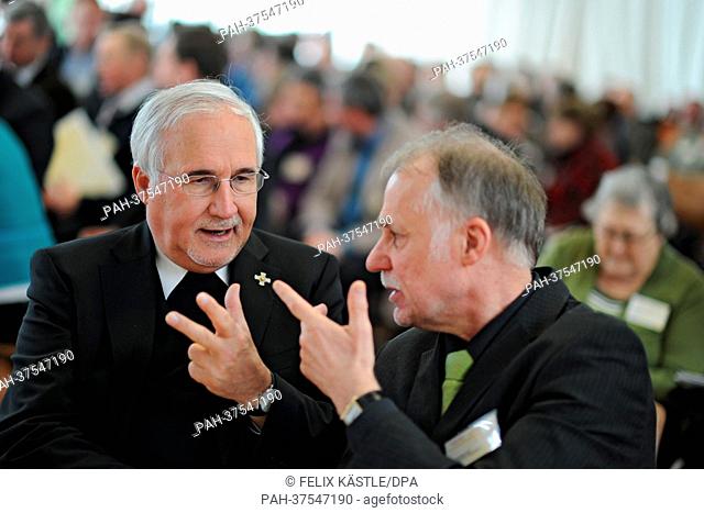Bishop Gebhard Fuerst (L) talks to the host of the panel Matthias Ball of the head office of the initiative 'Dialogprozess' (dialogue in process) of the...