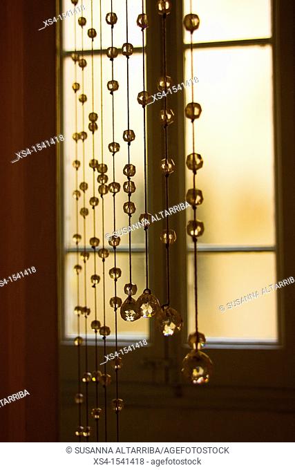Crystal beaded curtain in front of a window