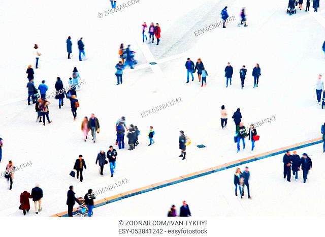 Crowd of people at a public square. Long exposure. Motion blur. Aerial view