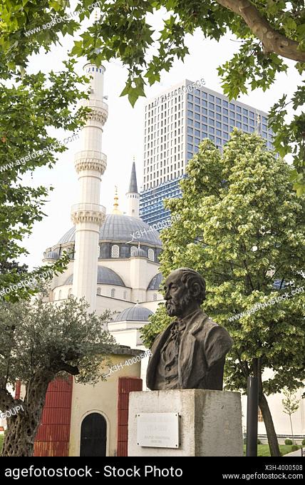 Bust of Jeronim de Rada (1814-1903, most influencial Albanian writer of the 19th century), with the Namazgjah Mosque in the background, Tirana, Albania