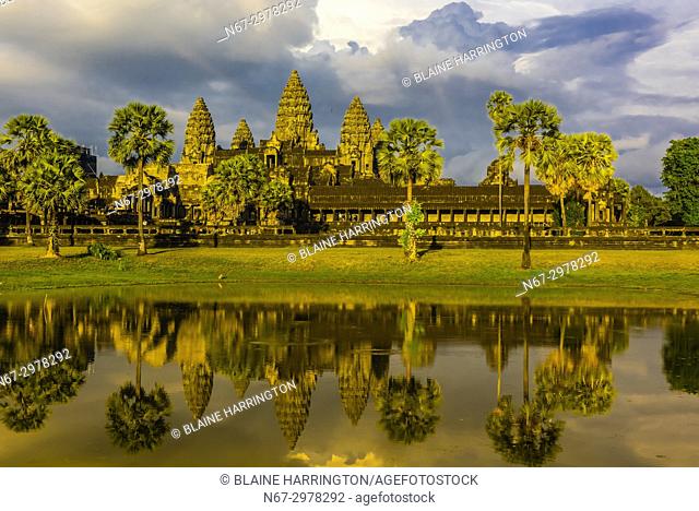 View of Angkor Wat with pond. It is the largest religious monument in the world. It's name means City which is a temple; Cambodia