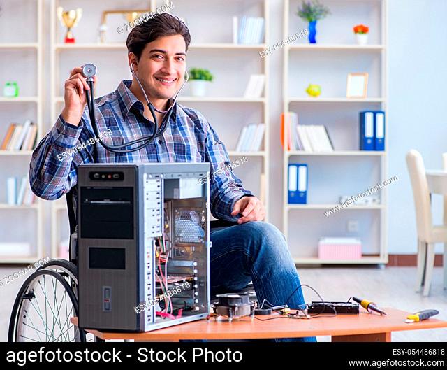 The computer repairman on wheelchair working