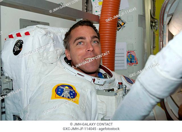 Attired in his Extravehicular Mobility Unit (EMU) spacesuit, Christopher Cassidy, STS-127 mission specialist, is pictured in the Quest Airlock of the...