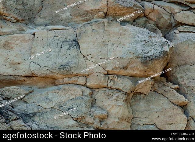 Background. The texture of the rock is made of light limestone, covered with cracks