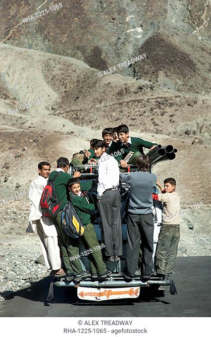 Children overload a local bus to get to school , Gilgit-Baltistan, Pakistan, Asia
