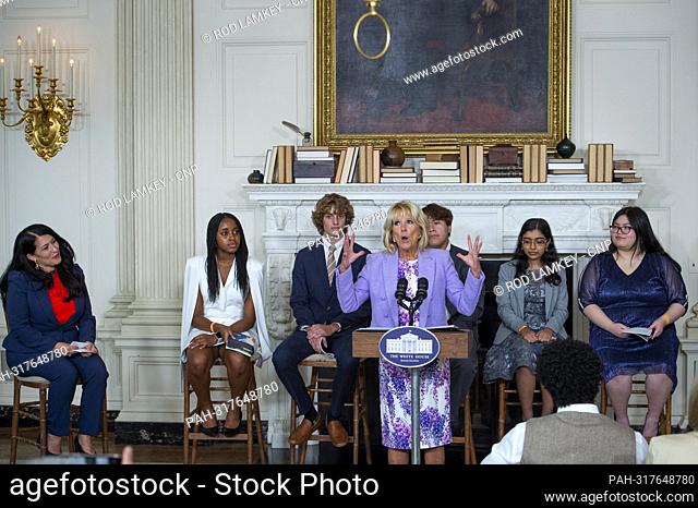 First lady Dr. Jill Biden, center, is joined by Ada Limón, 24th Poet Laureate of the United States, left, as she welcomes and introduces the Class of 2022...