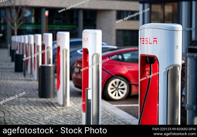 22 January 2022, Berlin: Tesla brand vehicles are parked at a series of Tesla fast-charging stations on the EUREF campus in Berlin-Schöneberg