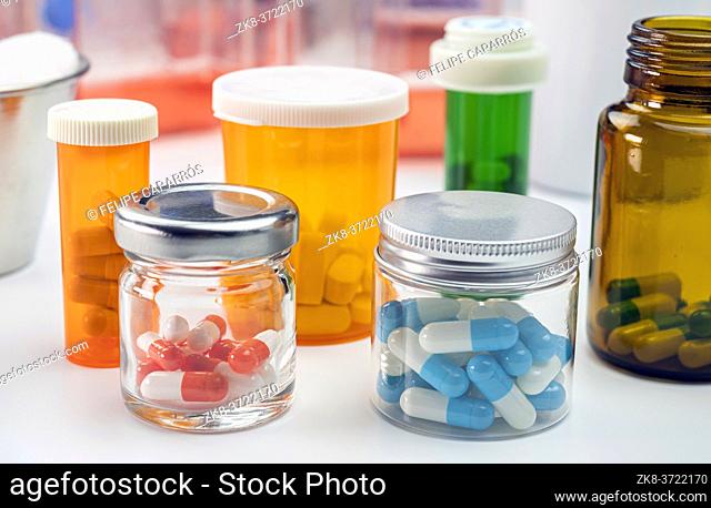 Pills boats orange with white tablets of different types