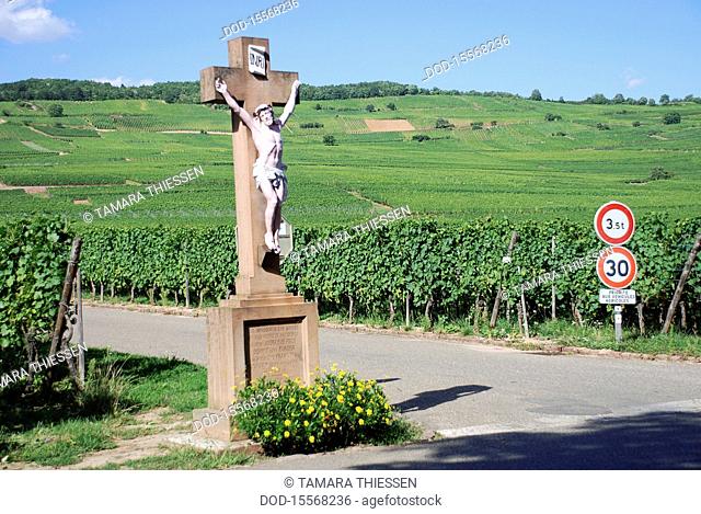 France, Alsace, Kientzheim, crucifix on roadside next to vineyards