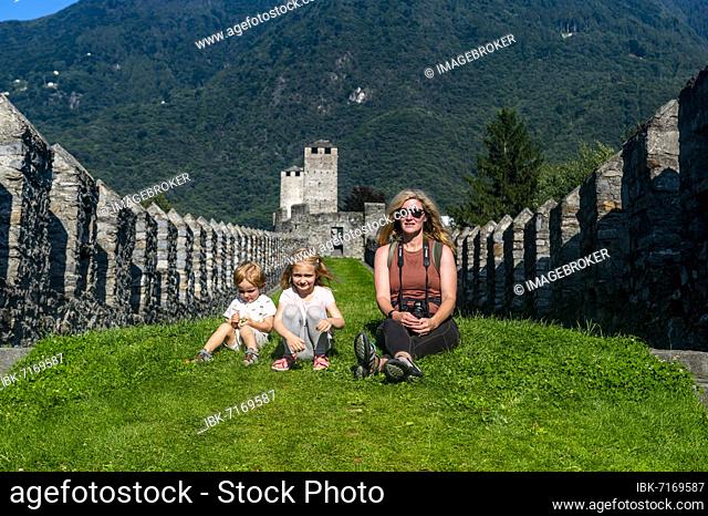 Mother with children, Castelgrande, Unesco site three castles of Bellinzona, Ticino, Switzerland, Europe