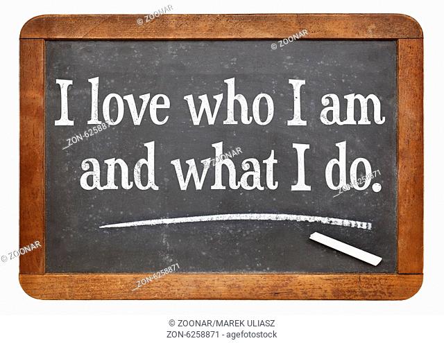 I love who I am and what I do - positive affirmation words on a vintage slate blackboard