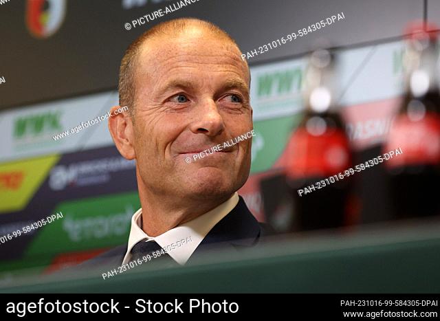 16 October 2023, Bavaria, Augsburg: Jess Thorup sits on the podium during his introduction as the new coach of FC Augsburg 1907