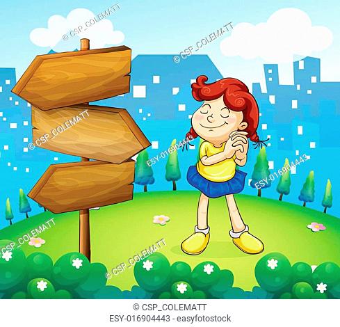 A little girl standing beside the wooden arrow boards