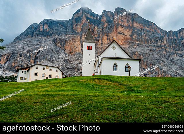 The sanctuary of Santa Croce under Sas dla Crusc, in the Dolomites of Val Badia, Italy