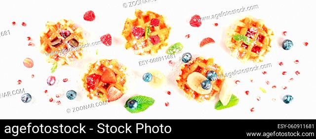 Belgian waffles panorama, an overhead flat lay shot with fresh fruit