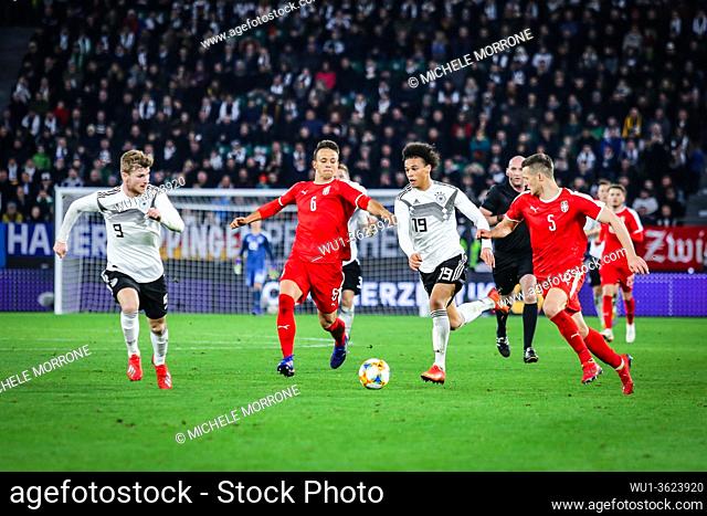 Wolfsburg, Germany, March 20, 2019: footballer Leroy Sané (GER) dribbling the Serbian opponents during the international soccer game between Germany and Serbia