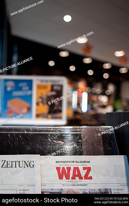23 December 2020, North Rhine-Westphalia, Oberhausen: Today's editions of the newspapers ""WAZ"" and ""NRZ"" of the Funke Media Group are available at a petrol...