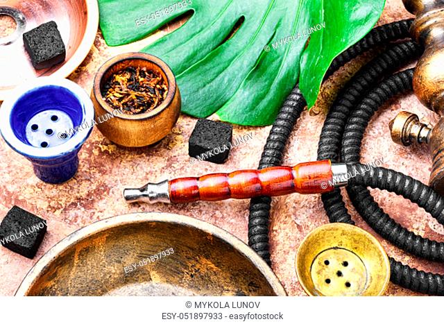 Details of the eastern kalian.Hookah with tropical flavor.Smoking tropical tobacco