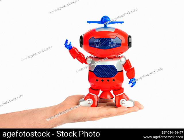 Hand with toy robot isolated on white background