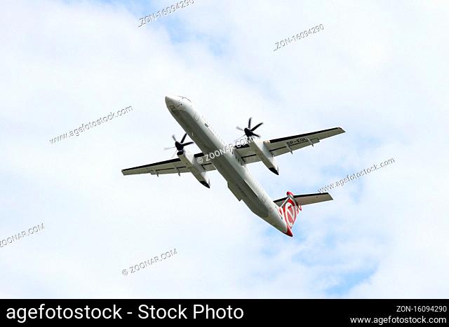 Polish airlines LOT turboprop Bombardier DHC-8-400 on the climbout after take-off from Warsaw Chopin Airport