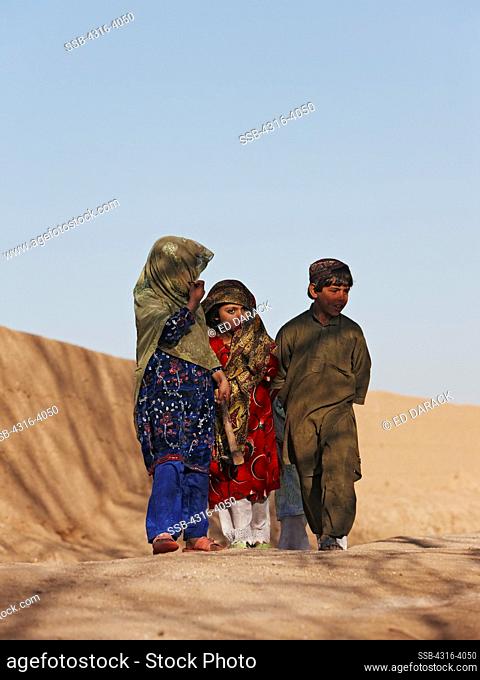 Children Walk Down a Dirt Path in Afghanistan's Helmand Province