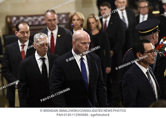 Acting Attorney General, Matthew Whitaker (2R), Secretary of the Treasury, Steven Mnuchin (R), and Secretary of Defence James Mattis (2L) look on as they leave...