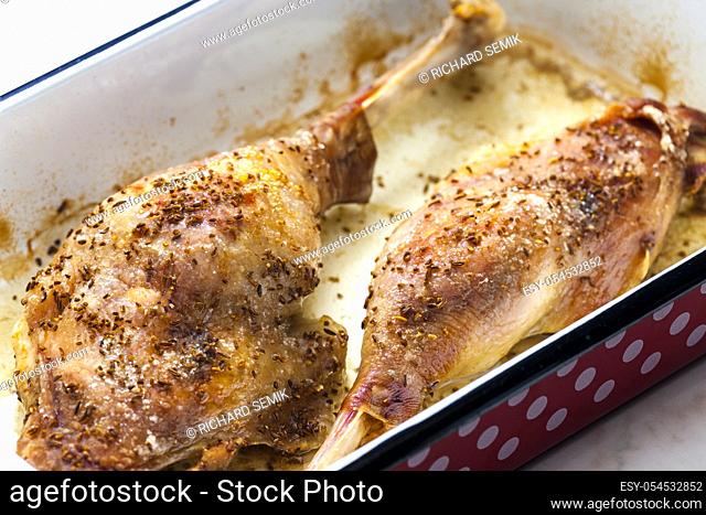 baked goose legs with cumin in frying pan