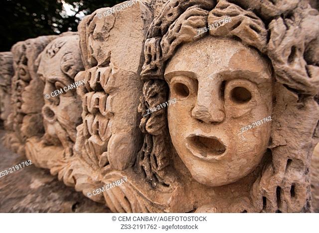 Stone carvings of theatre masks at ruins of Myra, Antalya Region, Turkish Riviera, Turkey, Europe