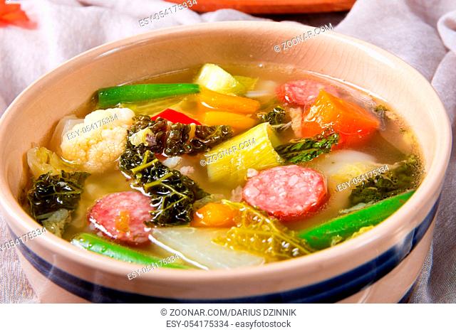 delicious autumnal vegetable soup with sausage and bacon