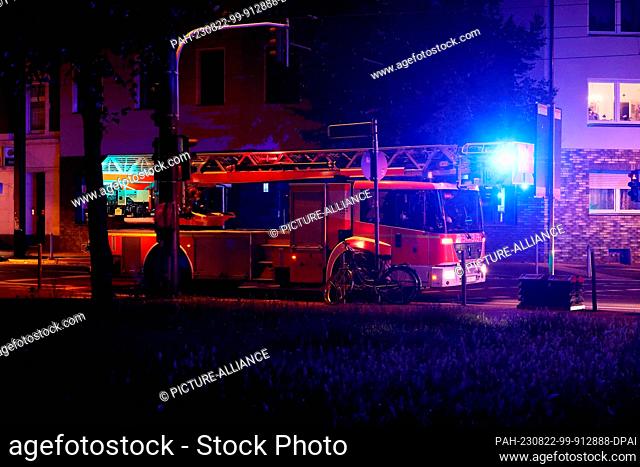 21 August 2023, North Rhine-Westphalia, Duesseldorf: A fire department car with blue lights stands near the scene of an accident in the Rhine bank tunnel in...