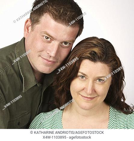 Loving married heterosexual couple posing for portrait