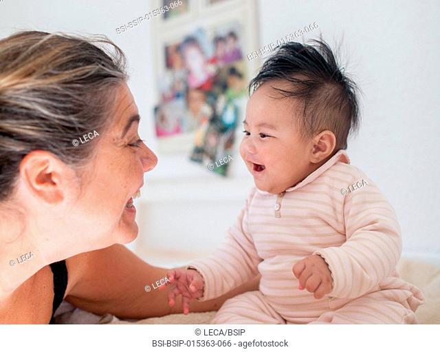 4-month old baby. This little Tahitian girl was adopted by people from the mainland of France