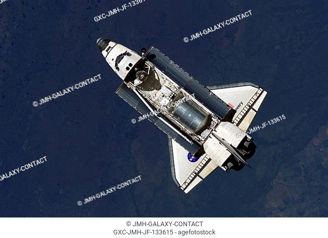 The Space Shuttle Discovery flies near the International Space Station for docking but before the link-up occurred, the orbiter posed for a thorough series of...