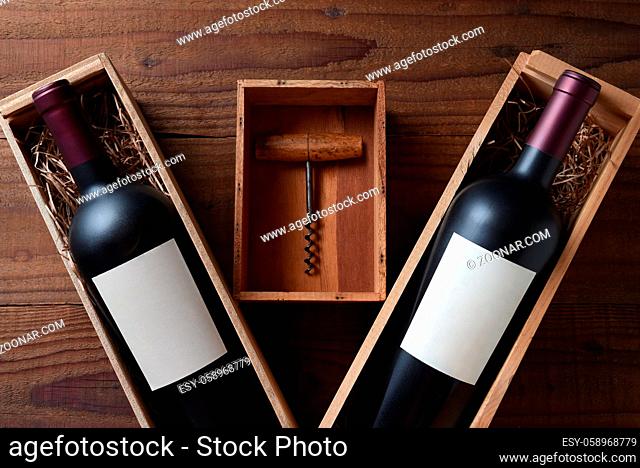 Wine Still Life: Two wood wine boxes with a bottle with blank labels. Between the boxes is a small box and an antique cork screw