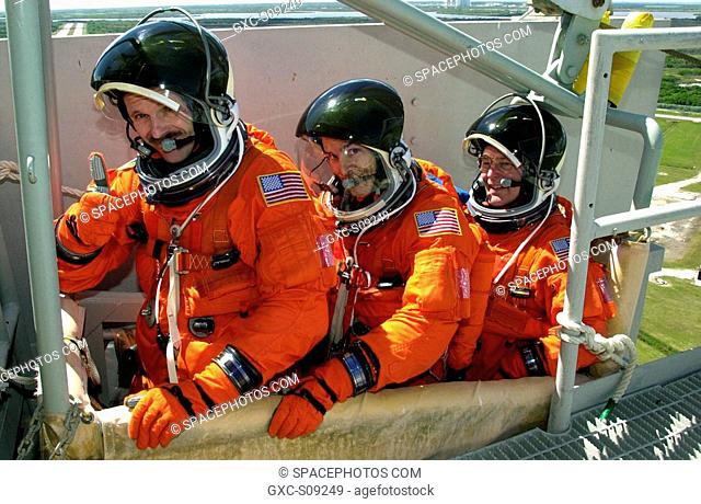 03/19/2002 -- -- STS-110 crew members sit in the slidewire basket, part of emergency egress equipment on the pad. From left are Mission Specialists Steven L