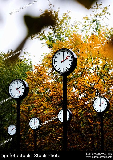 ILLUSTRATION - 25 October 2023, Duesseldorf: The clocks in the time field of the artist Klaus Rinke show 14 o'clock. On the last Sunday (29.10