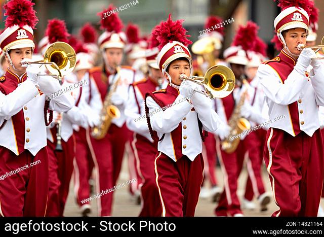 Holland, Michigan, USA - May 11, 2019: Tulip Time Parade, Members of the Holland Christian Middle School Band, standing stones, performing during the parade