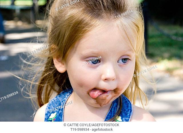 3 year old girl after eating an ice cream cone. Boston Public Garden. MR